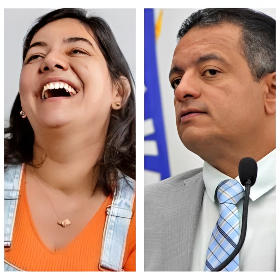 Viviane Facundes sorrindo ao lado de Léo do Ar discursando ao microfone