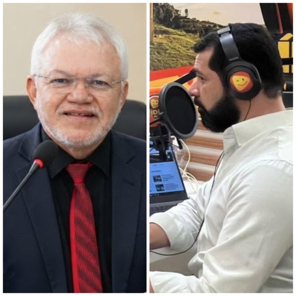 Fotografia em plano fechado do vereador Evandro da Destilaria, de Amaraji, vestindo terno escuro, camisa preta e gravata vermelha, participando de entrevista na Rádio Líder FM.